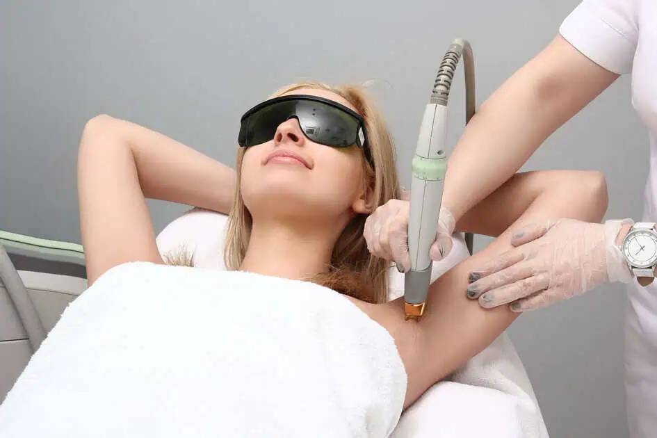 Woman receiving smooth, hair-free skin after laser hair removal treatment before summer